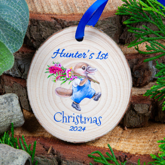 First Christmas ornament Playpus design wood slice